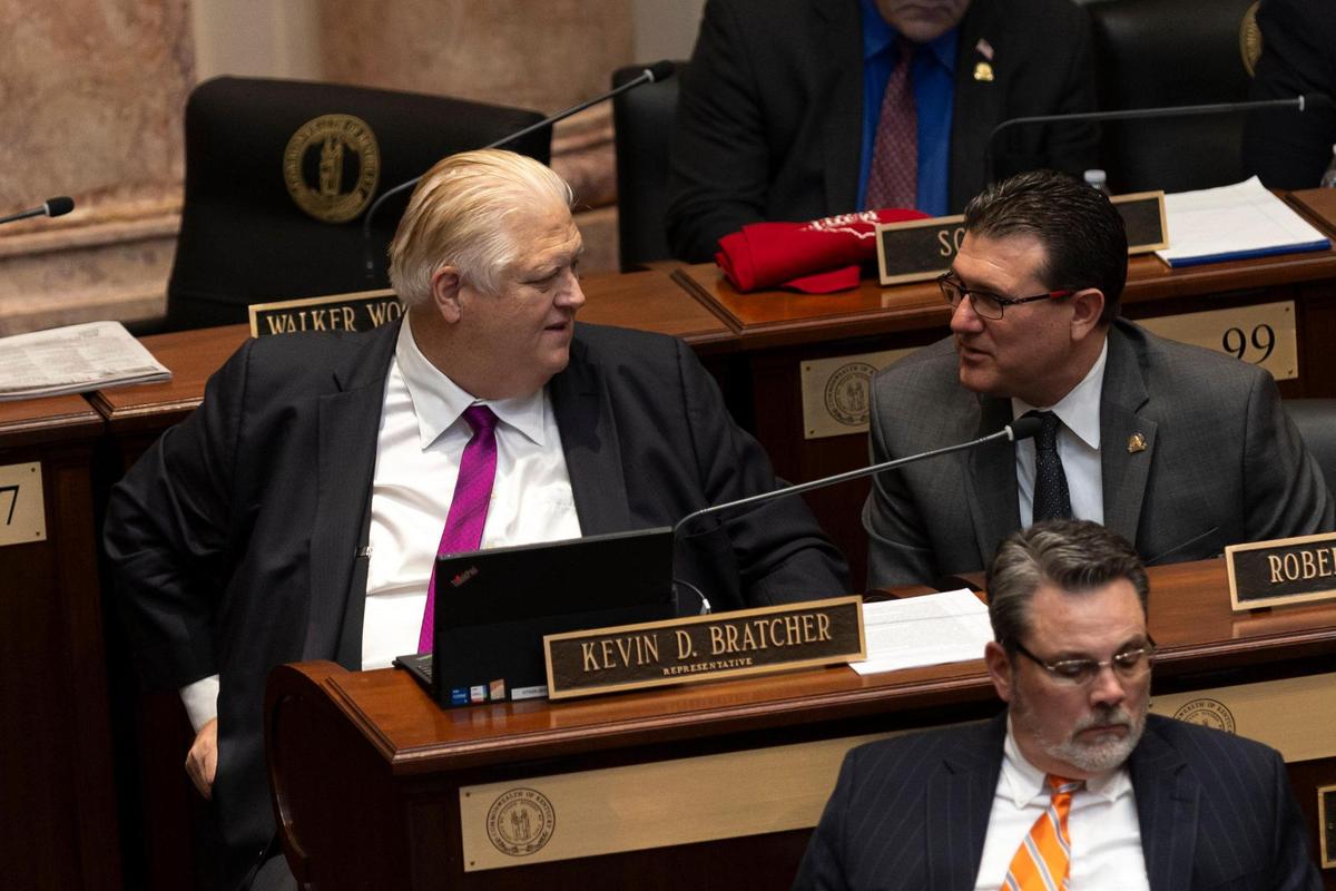 Rep. Kevin Bratcher talks with Rep. Robert Duvall during the legislative session at the Capitol in Frankfort, Ky, Tuesday, January 23, 2024.