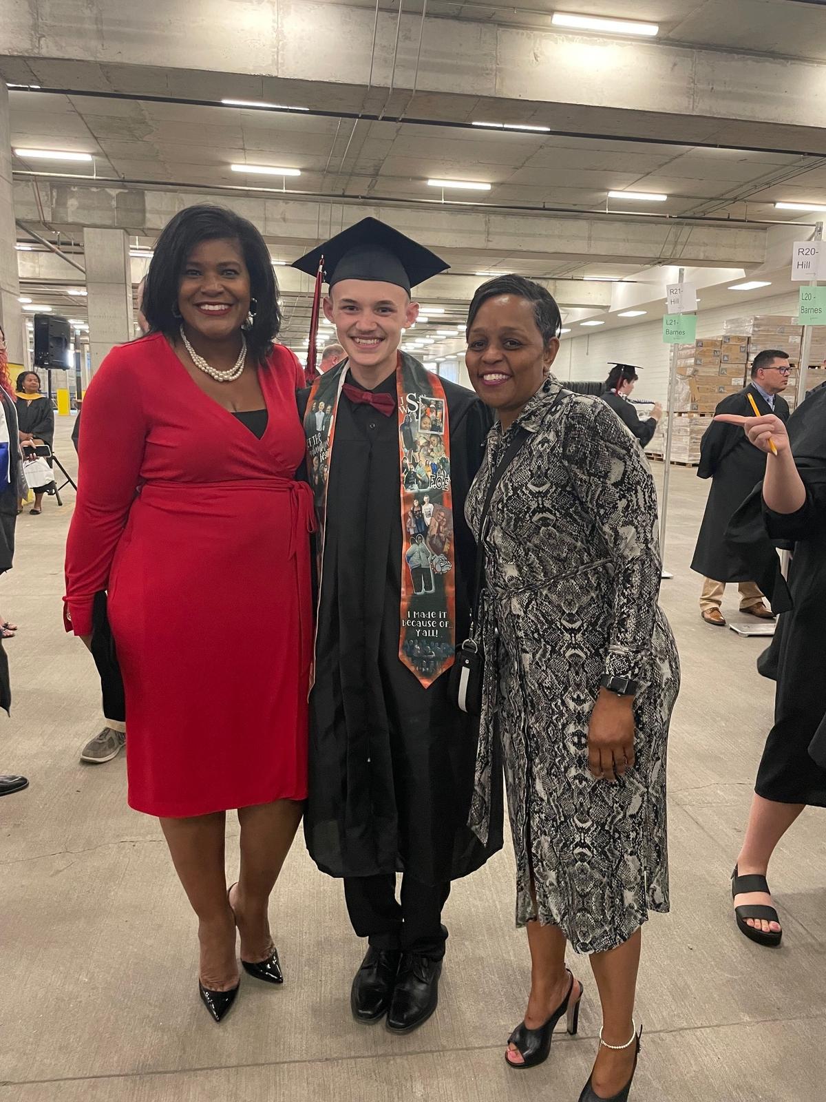 District Judge Melissa Murphy (left), Jaden Slone (center) and program coordinator Kivvi Figgs (right) pose for a photo at Slone’s graduation.