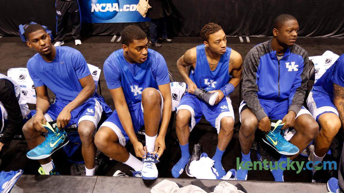 University of Kentucky men's basketball team players :-R: Kentucky Wildcats forward Alex Poythress (22) Kentucky Wildcats center Dakari Johnson (44),Kentucky Wildcats guard/forward James Young (1) and Kentucky Wildcats forward Julius Randle (30) put on their shoes before they practiced in Lucas Oil Stadium in Indianapolis, In., Thursday, March 27, 2014. UK plays Louisville tomorrow night in the NCAA Midwest Regional semifinals. Photo by Charles Bertram | Staff