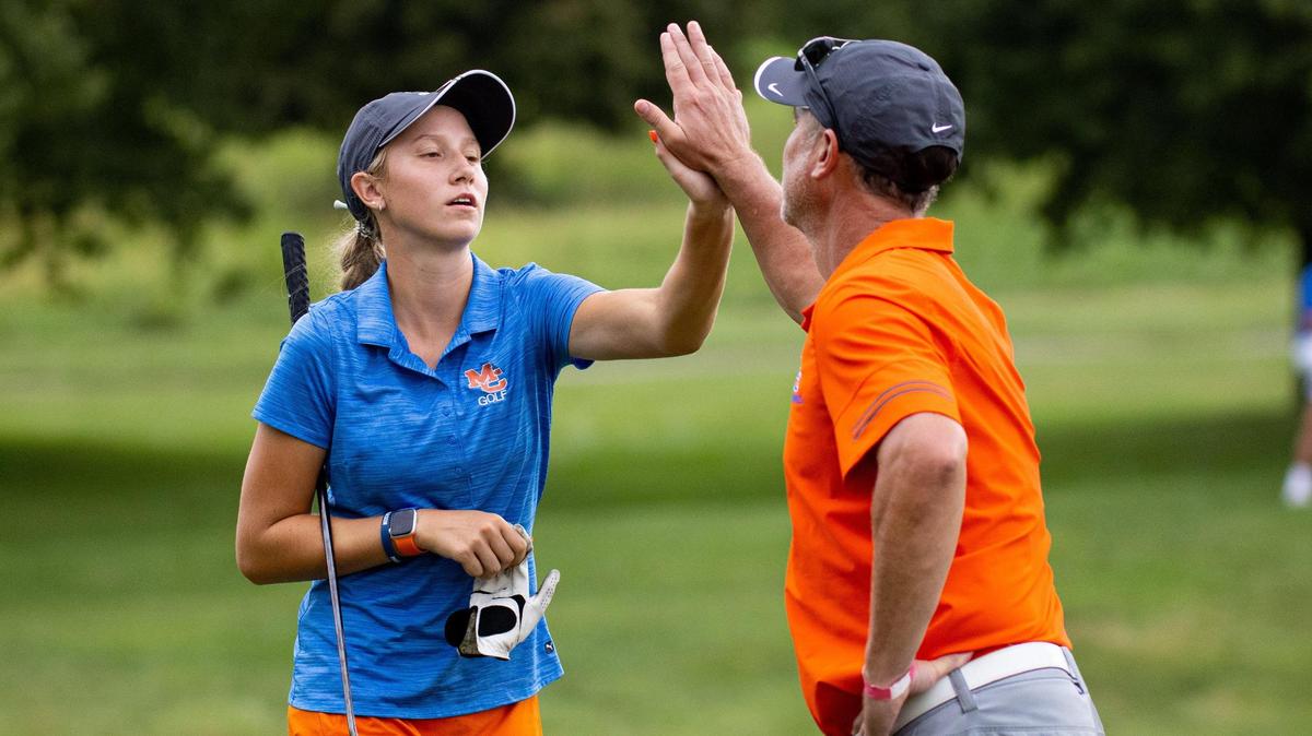 Marshall County’s Trinity Beth high fives her coach after making a putt during the KGCA All-State Championships last month at the University Club of Kentucky in Lexington.