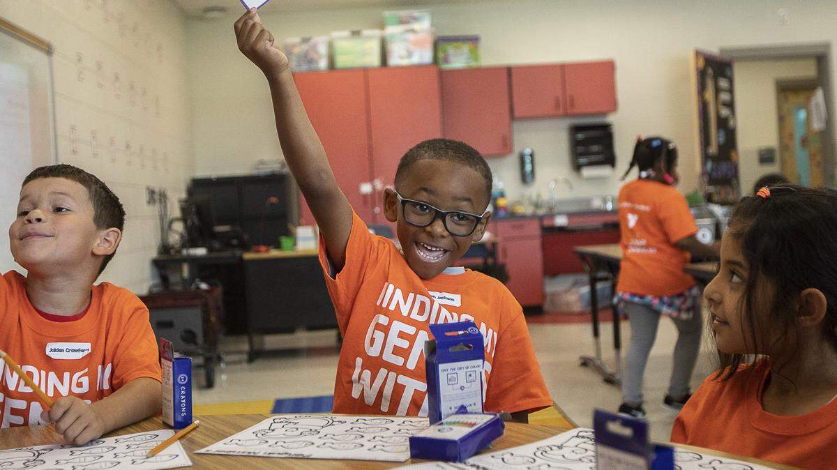 Elijah Jackson, a rising first-grade student, holds up a card while practicing number skills during the YMCA of Central Kentucky’s Power Scholars Academy at Coventry Oak Elementary School in Lexington, Ky., Wednesday, June 19, 2019.