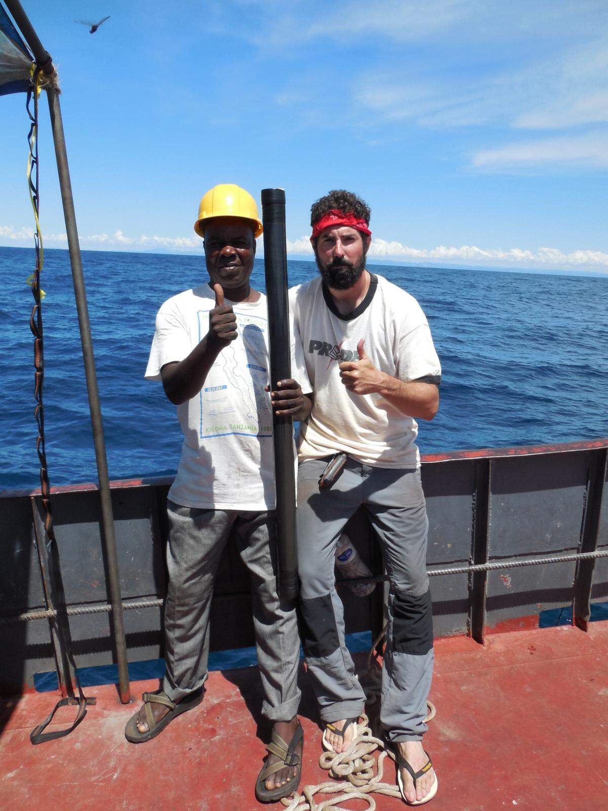 Michael McGlue and chief engineer Mupape celebrate the successful recovery of core LT17-2A, the first of its kind from southern Lake Tanganyika.