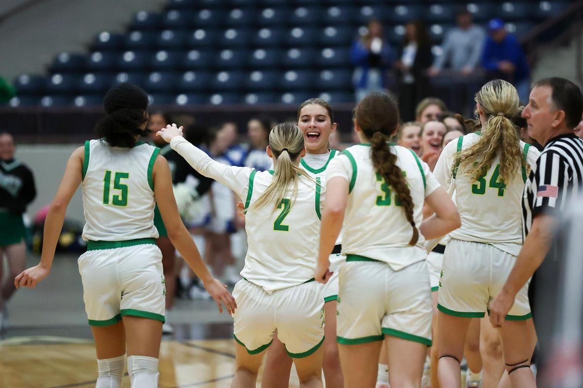 Owensboro Catholic celebrates defeating Bethlehem in the first round of the All “A” Classic small-school state championship tournament in Corbin on Thursday.