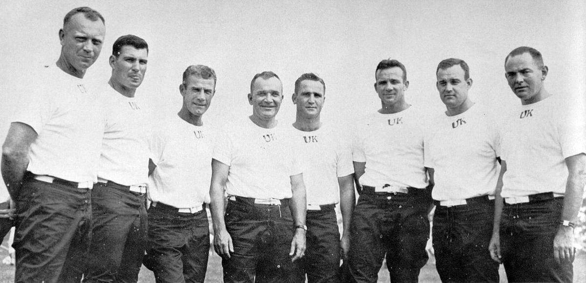 Kentucky football coaches, including Ed Rutledge, left, Howard Schnellenberger, Ermal Allen, Blanton Collier, Don Shula, John North, Bob Cummings and Bill Arnsparger, gathered for a photo in 1959.