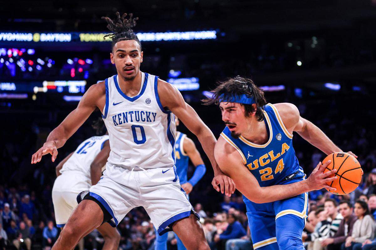 Kentucky’s Jacob Toppin (0) guards UCLA’s Jaime Jaquez Jr. (24) during Saturday’s loss to the Bruins in New York. Toppin is one of four Wildcats averaging double-figure scoring this season at 11.2 points per game.