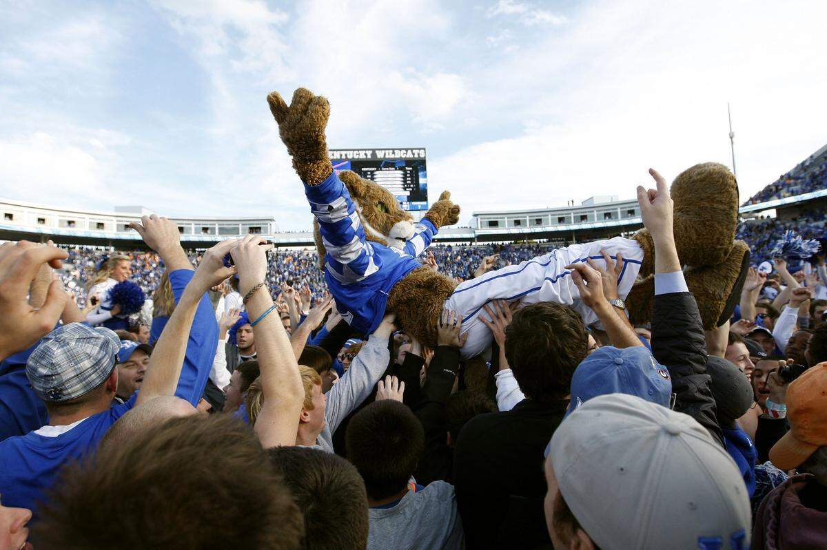 The Wildcat crowd surfs after Kentucky’s 10-7 defeat of Tennessee at Commonwealth Stadium on Nov. 26, 2011.