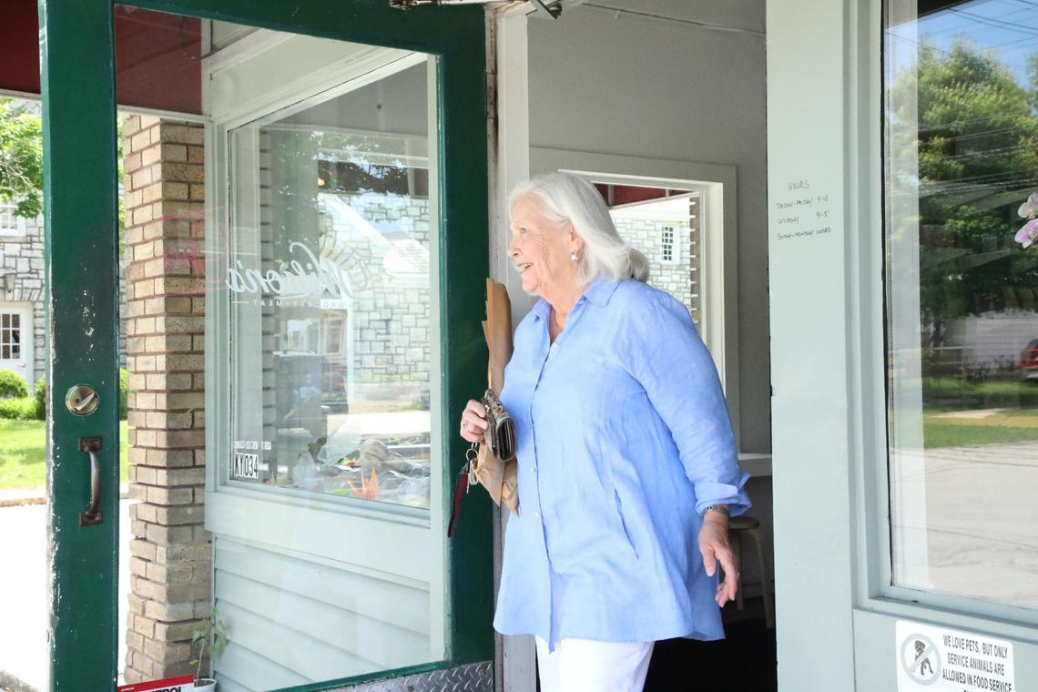 Pat Miller, who lives in the Kenwick neighborhood, left Wilson’s Grocery with fresh bread.