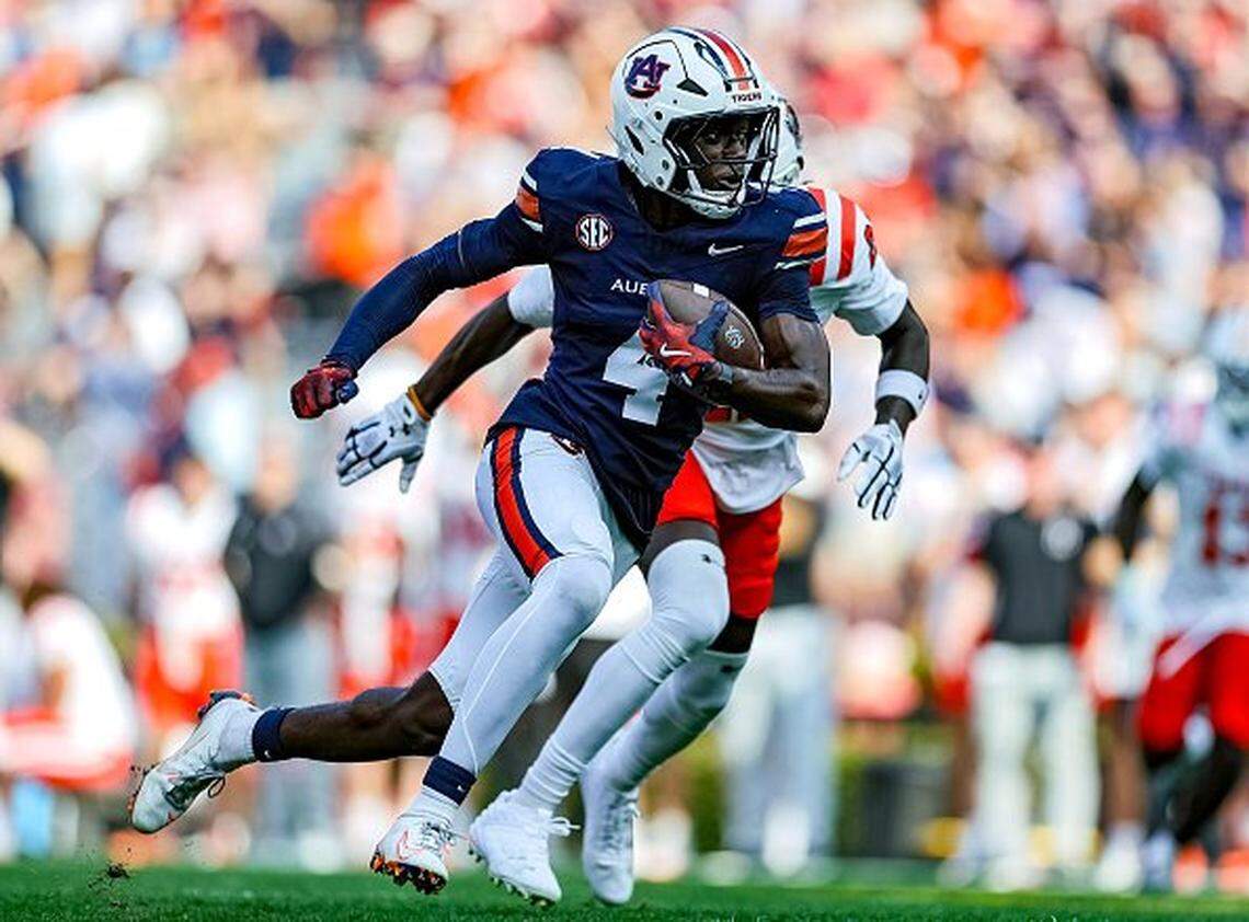 AUBURN, ALABAMA - NOVEMBER 22: Malcolm Simmons #4 of the Auburn Tigers breaks into the open field during the first half against the Mercer Bears at Jordan Hare Stadium on November 22, 2025 in Auburn, Alabama. (Photo by Brandon Sumrall/Getty Images)