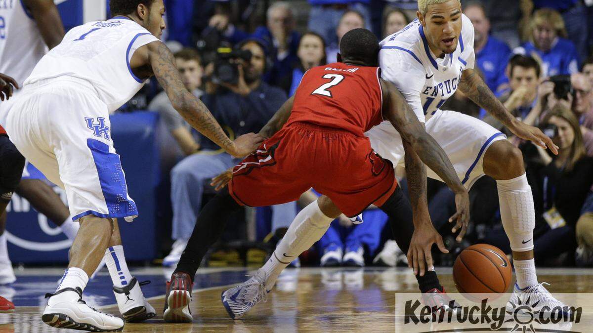 Kentucky Wildcats forward Willie Cauley-Stein (15) stole the ball from Russ Smith,2, as #18 Kentucky defeated #6 Louisville 73-66  on Saturday December 28, 2013 in  Lexington ,Ky.  Photos by Mark Cornelison | Staff