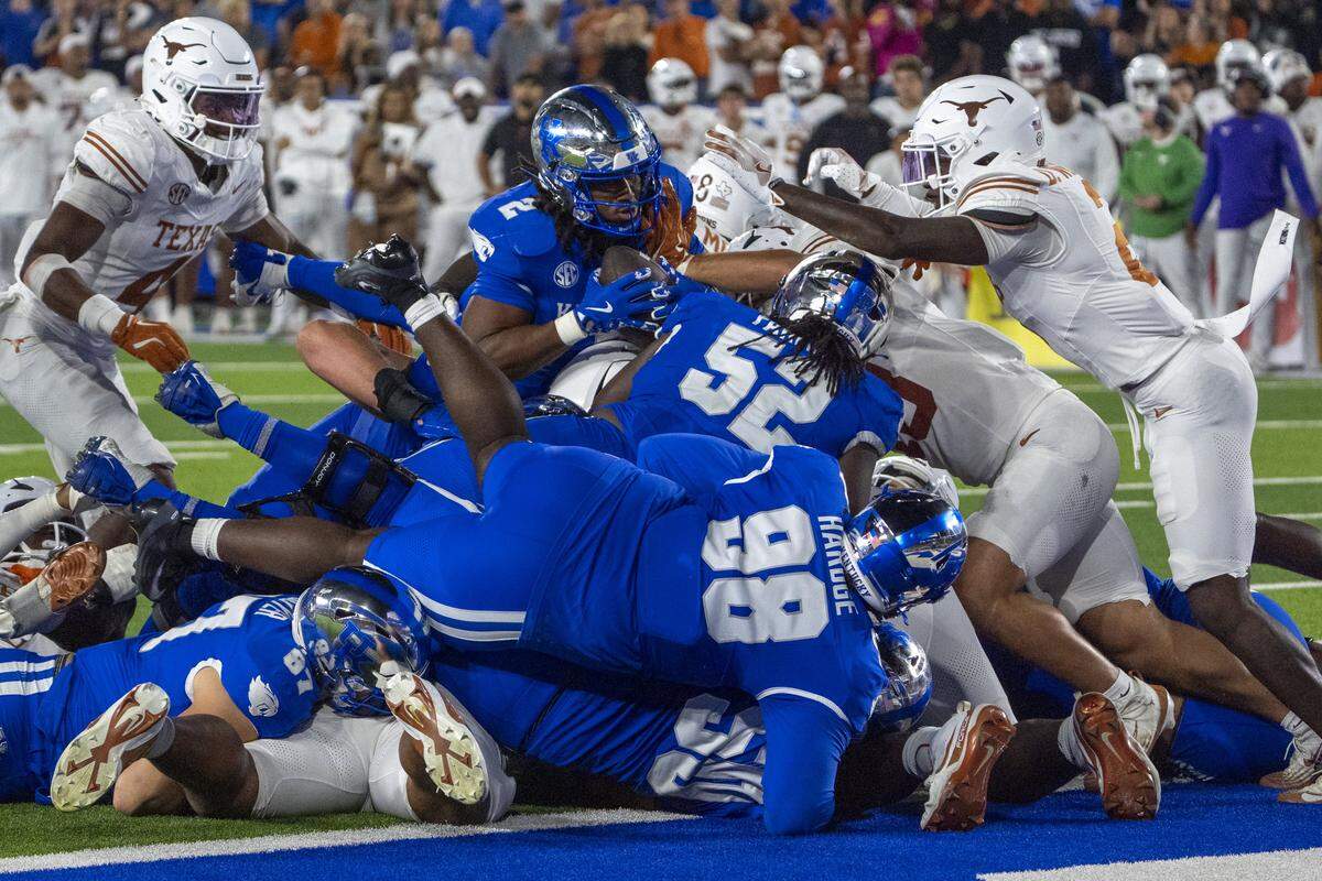 Kentucky running back Dante Dowdell (2) was stopped short of the goal line by the Texas defense during the Wildcats’ overtime loss Saturday at Kroger Field.