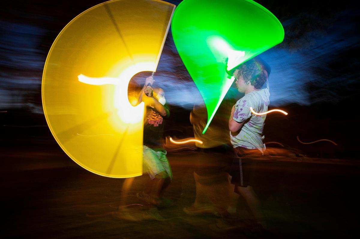 Jonathan Thompson, left, and Williams Atkinson, both of Lexington, Ky., duel each other with plastic lightsabers during a weekly practice session with the Lexington Lightsaber League at Woodland Park in Lexington, Wednesday, Sept. 29, 2021.