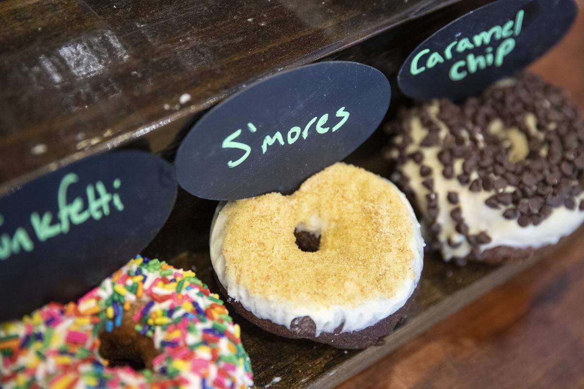 Donuts are displayed at a North Lime Coffee & Donuts on Thursday, June 6, 2019.