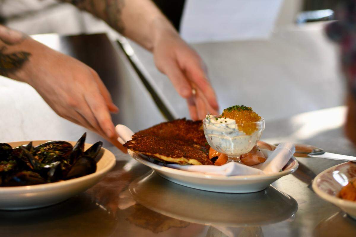 A cider-inspired dinner at Honeywood Restaurant will include hoecakes with smoked sturgeon, honey butter and caviar.
