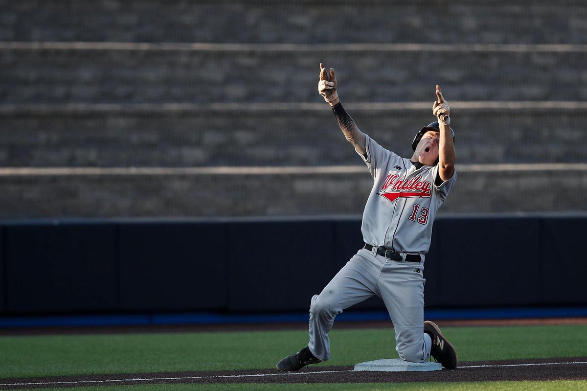 Whitley County’s Sam Harp celebrates hitting an RBI triple against Henderson County during the state high school baseball tournament semifinals at Kentucky Proud Park on Friday.
