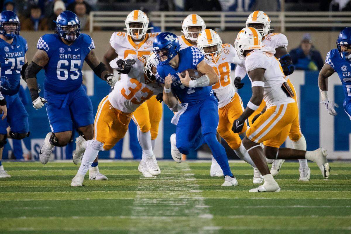 Kentucky quarterback Will Levis (7) is tackled by Tennessee linebacker Jeremy Banks (33) during their game at Kroger Field on Nov. 6, 2021. The Vols prevailed 45-42.