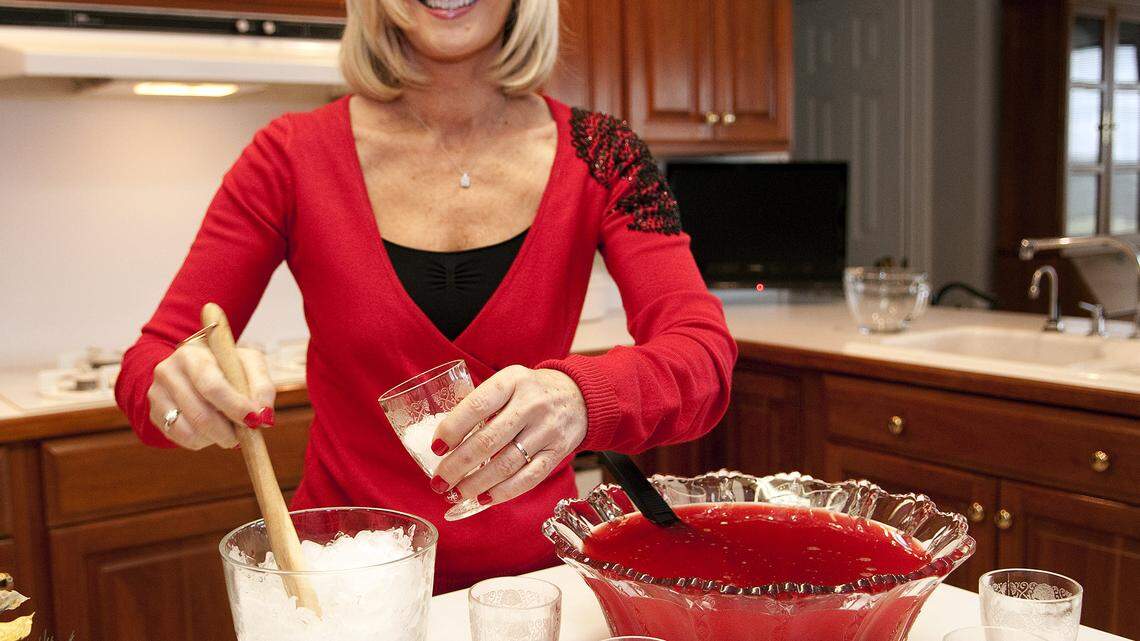 Betty Givan of Richmond, creates how-to videos in the kitchen, such as making holiday punch, then posts them on Youtube where she can eventually generate revenue from online ad sales.
Photo by Tim Webb  