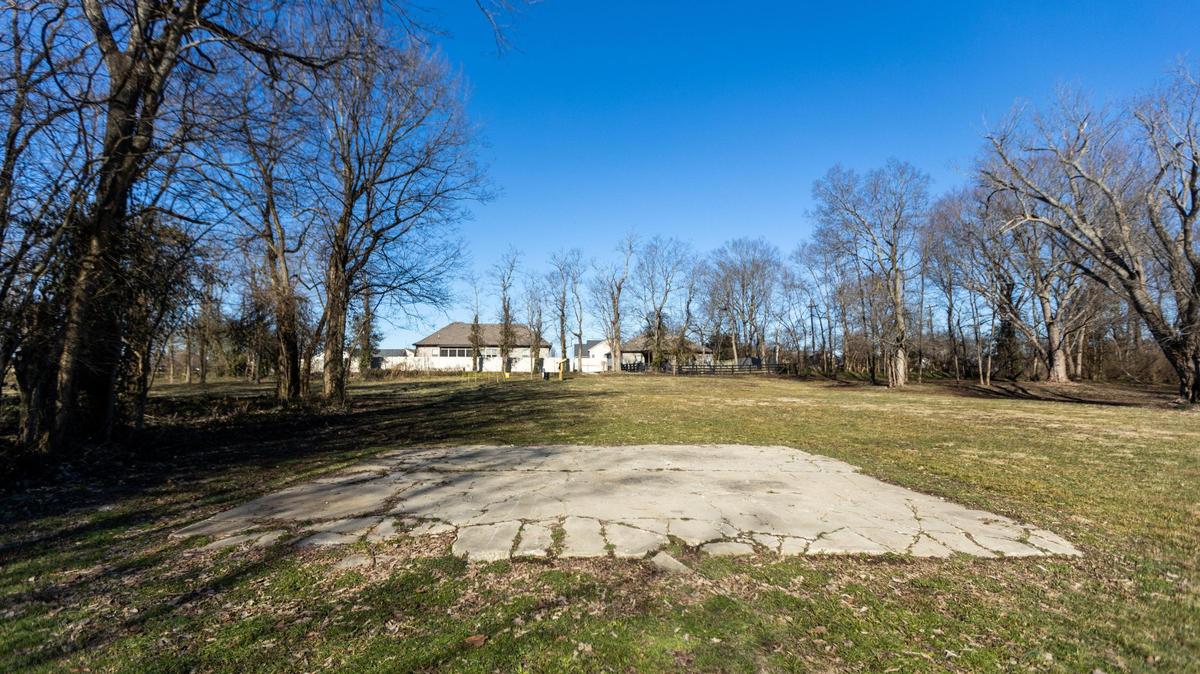 A concrete pad remains of a former store within Huntertown, a historic Black community in Versailles. UK Architecture students are pairing with Woodford county to create an interpretive park that honors the community. Jan. 26, 2022.