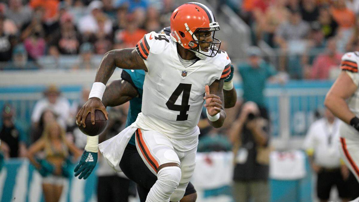 Browns quarterback Deshaun Watson scrambles in front of Jaguars linebacker Josh Allen during the first half of a preseason game on Aug. 12 in Jacksonville, Fla.