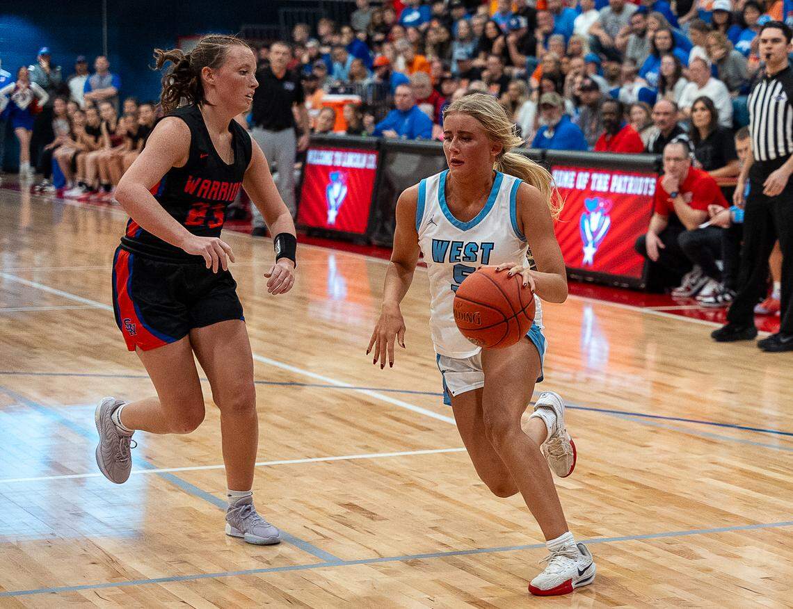 West Jessamine’s Isabella Lewis (5) drives to the basket against Southwestern’s Kylie Dalton during the girls 12th Region Tournament championship game at Lincoln County High School in Stanford on Saturday.