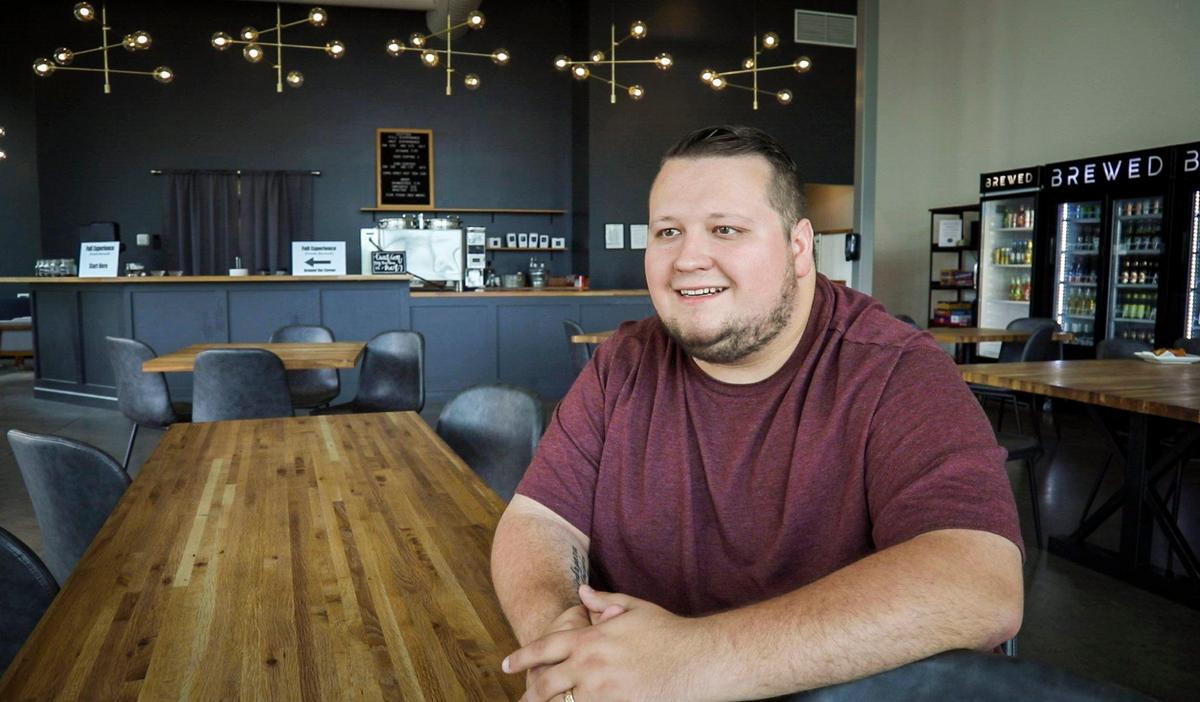 Owner of Brewed, Andrew Cooperrider, poses for a portrait during the shops first week of business in Lexington, Ky., Wednesday, June 17, 2020. Brewed offers coffee, beer and select food items off of Richmond Rd. and Malibu Drive.