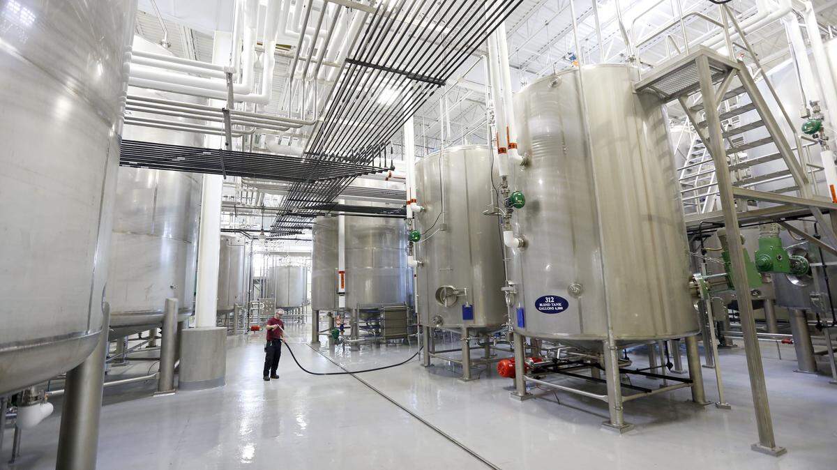 Jody Ennis sprayed down the area next to the tanks in the facility, which will be the main packaging site for the majority of Gruppo Campari's U.S. distilled spirits brands.  