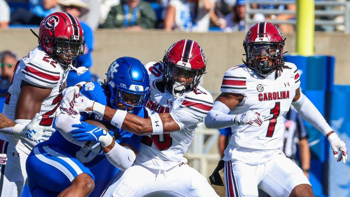 Kentucky running back Demie Sumo-Karngbaye is tackled by South Carolina defensive back Judge Collier (20) during Saturday’s game.