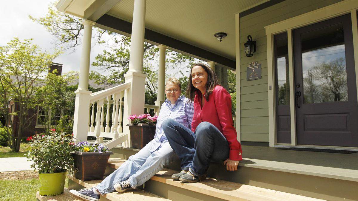 Above: Homeowner Tomi Ross, left, with Angela Forsee of Greystone Restorations at Ross's home on Bassett Avenue in Kenwick, which was rebuilt after the home she had lived in for decades was destroyed by fire last year.  
Left: The master bedroom of Ross's home 
Right: The free-standing tub in the master bathroom at Ross's home.       