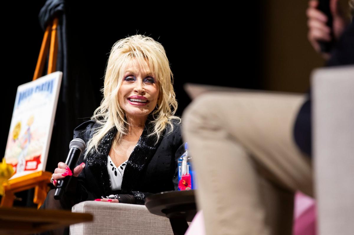 Dolly Parton answers questions from First Lady Britainy Beshear and Gov. Andy Beshear at the Lyric Theater in Lexington, Ky., on Tuesday, August 27, 2024.