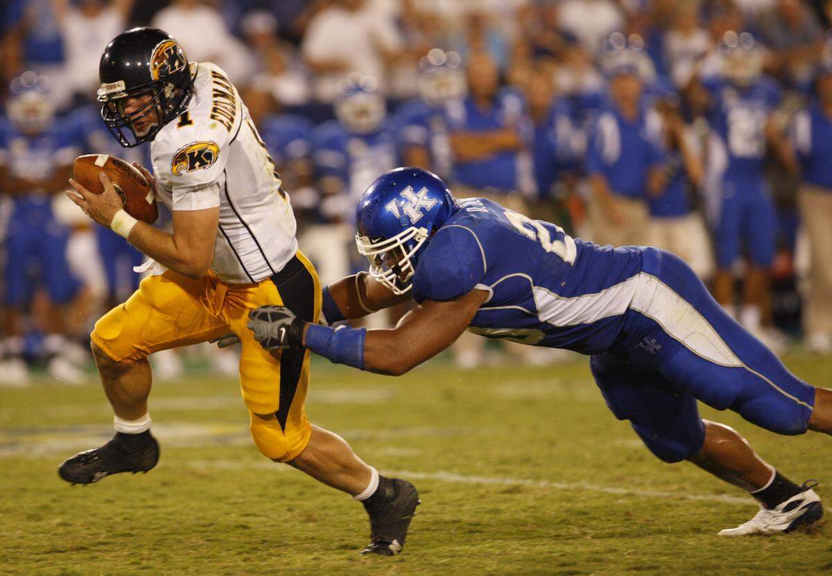 Kent State quarterback Julian Edelman slipped past the grip of UK’s Dominic Lewis after recovering his own fumble in what became a 56-20 Kentucky victory in the second game of the 2007 college football season.