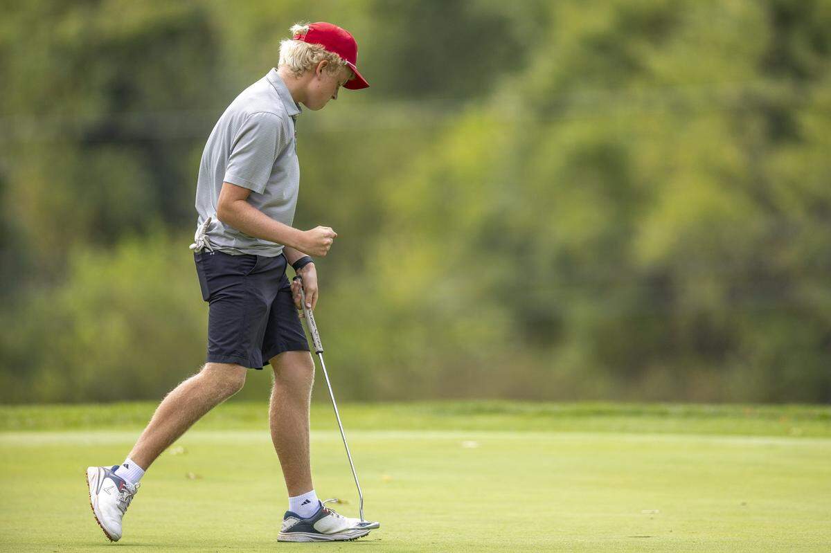 Andrew Perry of George Rogers Clark reacts after putting on hole 12 during the Boys 9th Region Championship golf tournament at the University Club at Arlington in Richmond, Ky., on Monday, Sept. 22, 2025.  