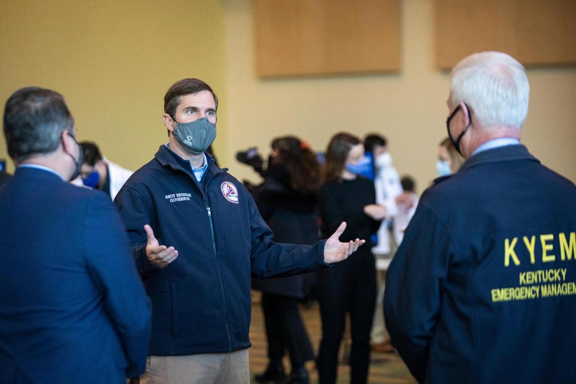 Gov. Andy Beshear speaks with officials at the new high-volume regional vaccination center at the Horse Park in Lexington, Ky., Tuesday, February 2, 2021. The site is being run in partnership with Kroger and will offer 3,000 appointments in the first week.