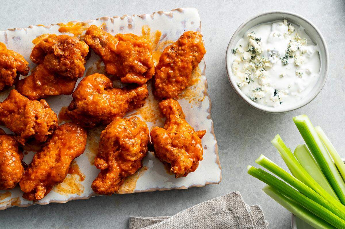 Chicken wings need to be coated in potato starch or cornstarch to help get that extra-crispy crunch.