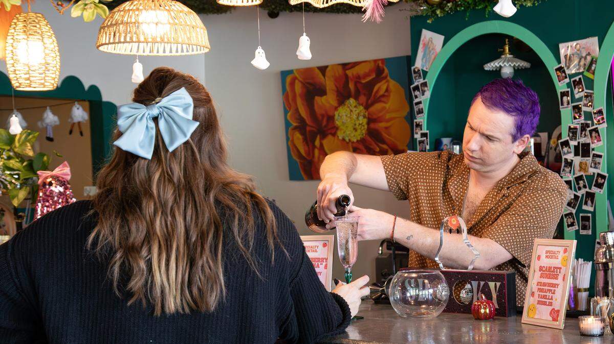 Bartender Jake Terry serving spirits during a private&nbsp;event at Poppy’s Flower Bar, located at 210 Old Mt Tabor Rd on Oct. 4, 2025, in Lexington, Ky.