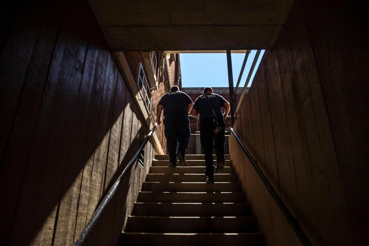 Dwayne Oliver, left, an EMT, and Doug Byers, a paramedic, return to the Lee County EMS station in Beattyville, Ky., after responding to a call on Tuesday, Sept. 7, 2021.