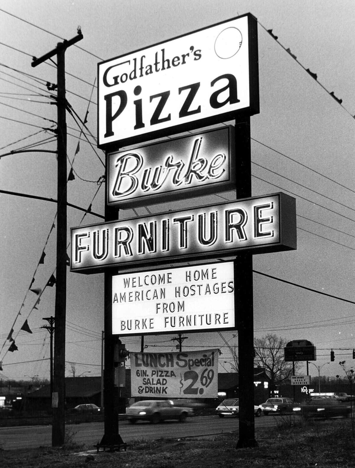 A sign at 2950 Richmond Road in Lexington, Jan. 20, 1981, celebrating the realease of 52 Americans held hostage by Iran for 444 days. The Iran hostage crisis began Nov. 4, 1979 after the U.S. Embassy in Tehran was taken over. Today, Burke furniture is still located on Richmond Road, however this location for Godfather's Pizza closed in the late 1980's. Note in the background - toward the lower right side of the photo - is a Kroger grocery store that has since moved down Richmond Road, closer to the Man o'War Boulevard intersection. Photo by Charles Bertram | staff