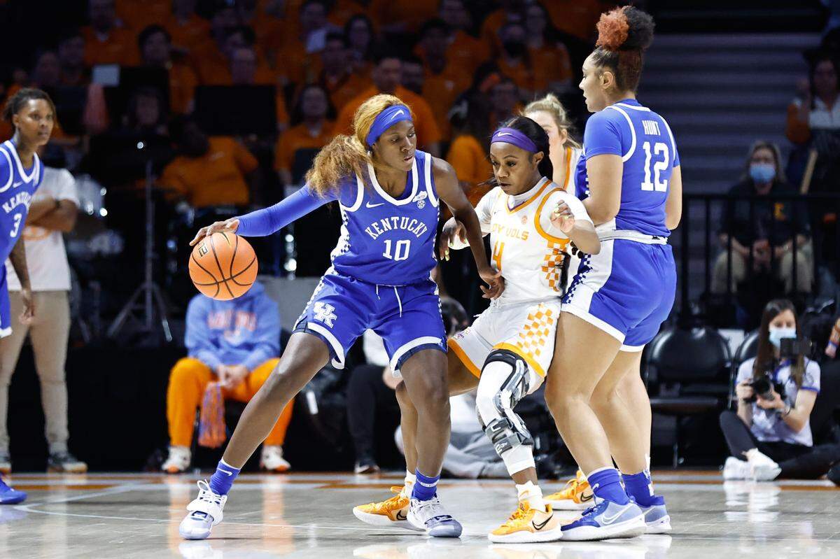 Kentucky’s Rhyne Howard (10) works for a shot as Treasure Hunt (12) sets a screen on Tennessee’s Jordan Walker (4) during Sunday’s game. Howard scored 24 points in the UK loss.