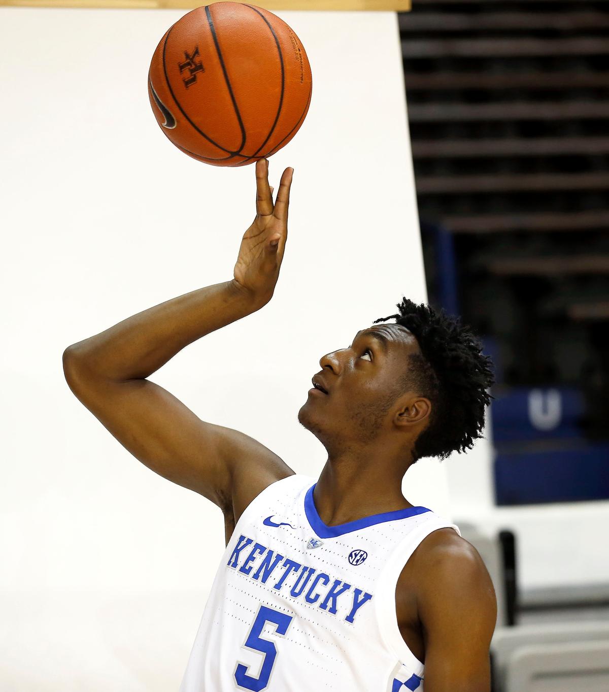 Immanuel Quickley spun a basketball on his fingertip during the Kentucky men’s basketball team photo day held Thursday afternoon in Memorial Coliseum.