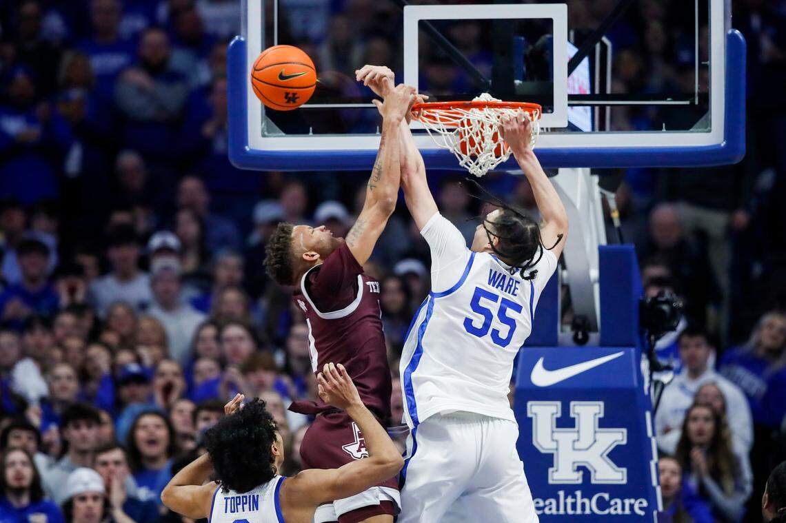 Kentucky’s Lance Ware (55) blocks a shot attempt by Texas A&M’s Dexter Dennis (0) at the rim during Saturday’s game at Rupp Arena.