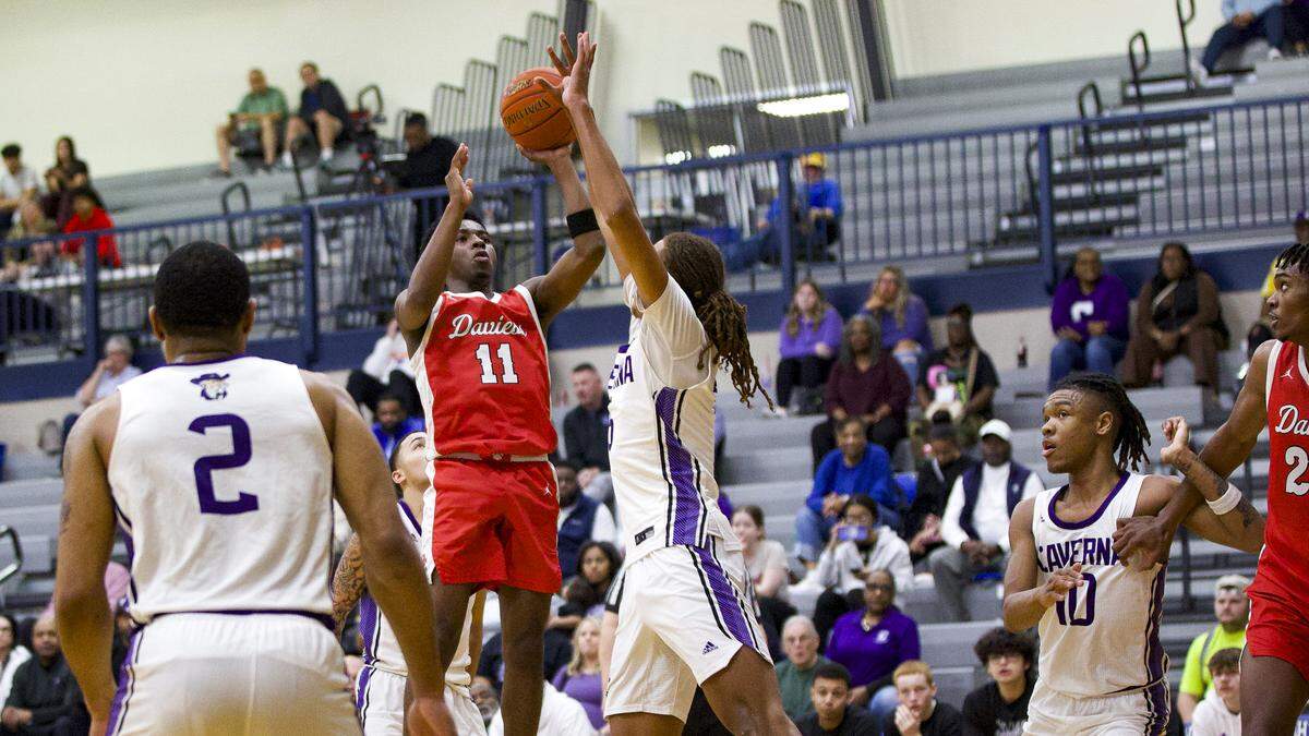 Daviess County’s Jonathan Moss (11) put up a shot against Caverna during the Panthers’ 54-47 win in the White, Greer & Maggard Holiday Classic at Lexington Catholic High School on Sunday.