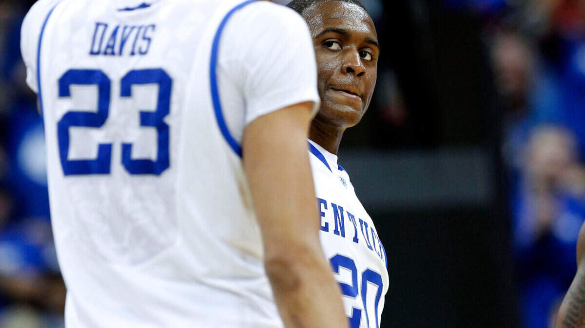 UK s Doron Lamb slapped hands with Anthony Davis, left, after a  Lamb basket as the University of Kentucky played Western Kentucky  University in the second round of the NCAA tournament played in the  KFC Yum Center in Louisville, Ky., Thursday, March 15, 2012. This  is second half action. Charles Bertram oe Staff