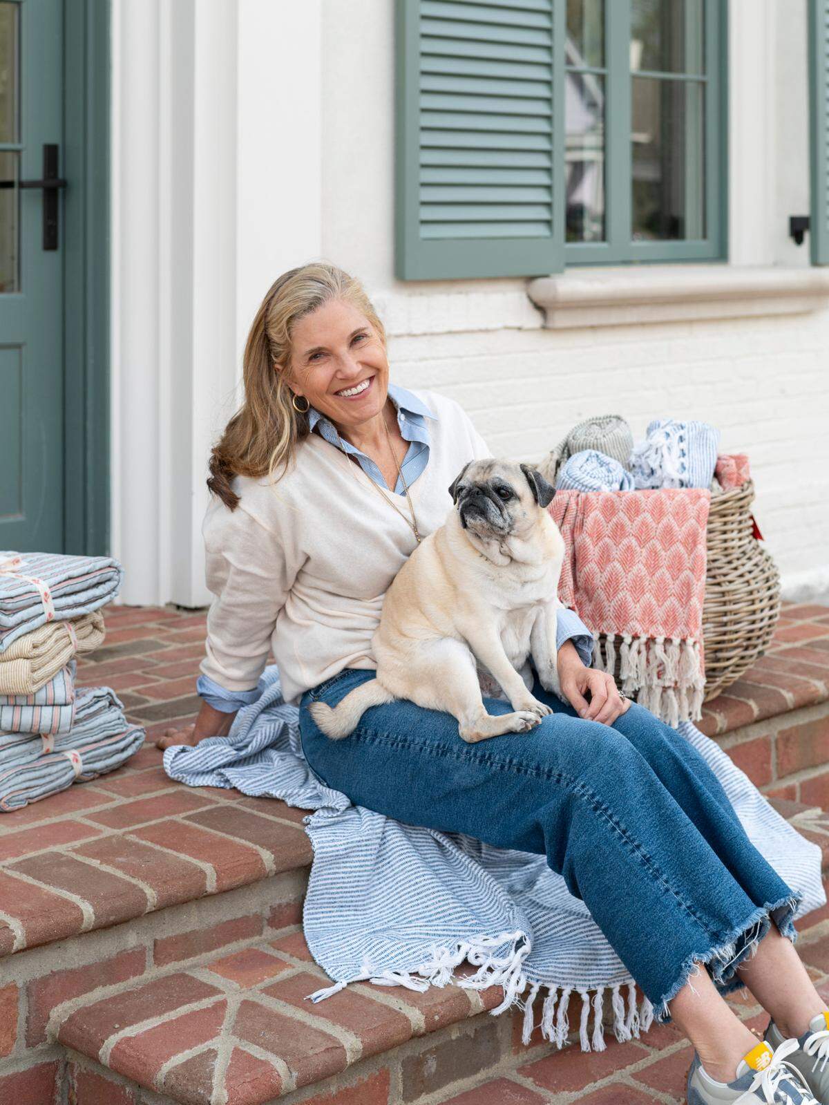 Pomegranate founder and creative director Angela Beck, with her pug Penelope, is opening a new store opening at 700 E. Main St. in Lexington on Dec. 3. Pomegranate also will have a cafe, Penny’s at Pomegranate, serving a menu created by chef Ouita Michel and wines from Beck’s Oregon vineyard.