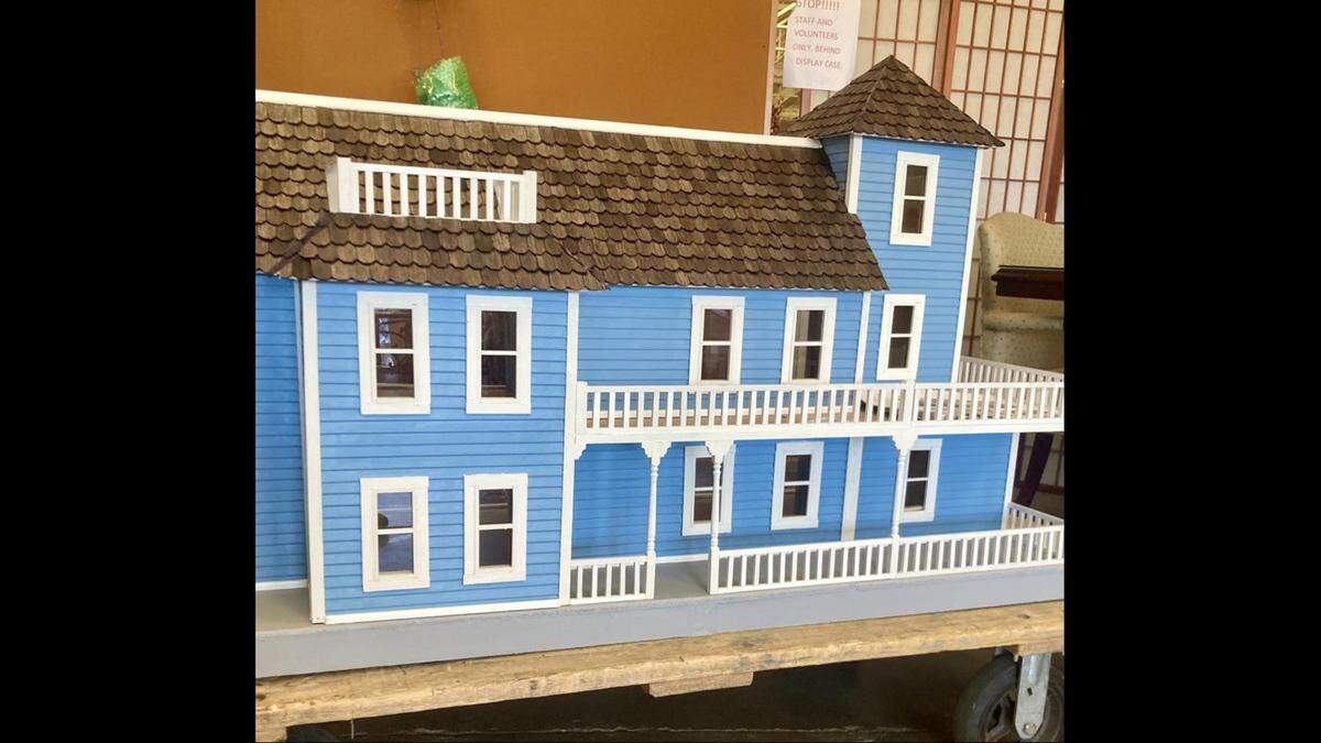Larry Kuharik, who volunteers three days a week at the Lexington Habitat ReStore, built a dollhouse from a kit that was donated. He said the kit was missing the doors, windows, shingles and some other pieces, so he crafted those himself.