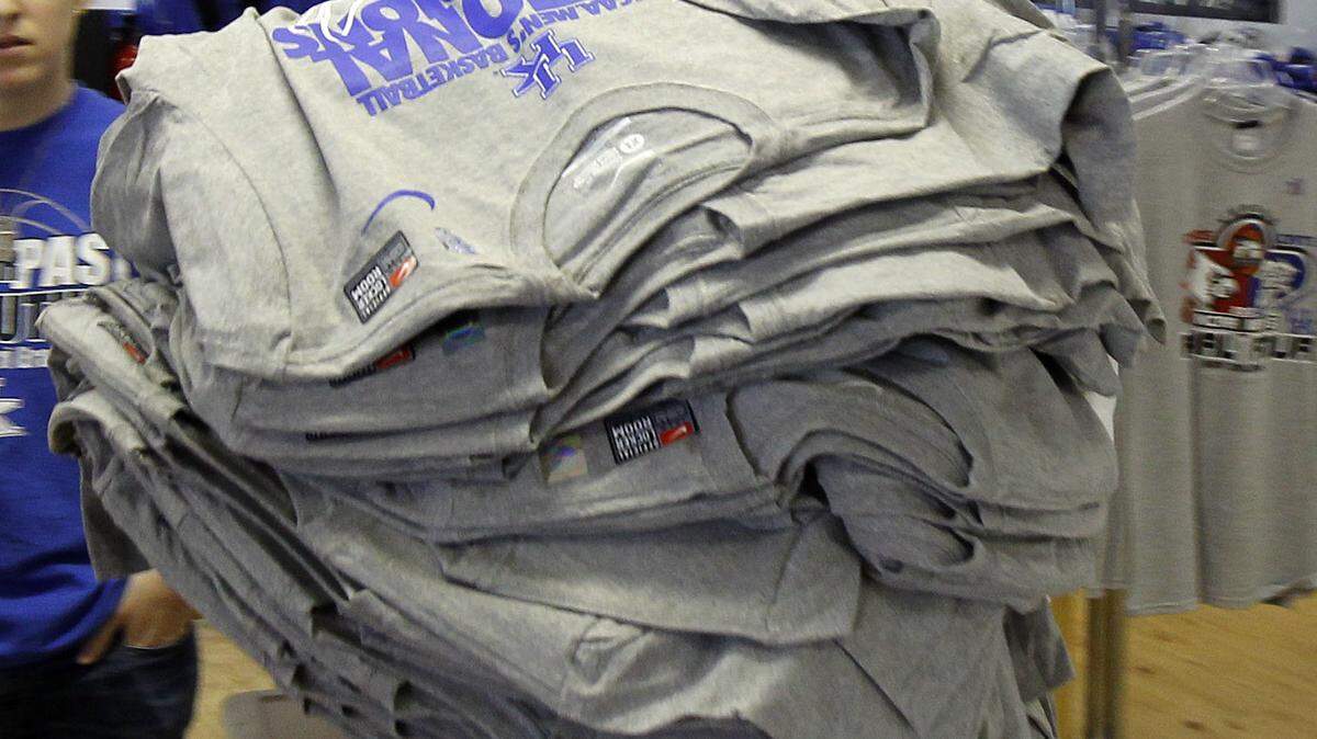 After Kentucky won the 2012 NCAA basketball title, Fan  Outfitters employee Nic Johnson brought out an  armload of championship T-shirts.  