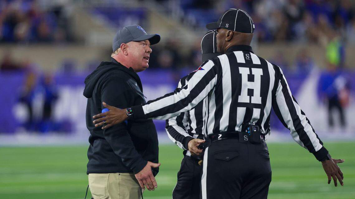 Kentucky head coach Mark Stoops argues with an official during Saturday’s game against Auburn at Kroger Field.