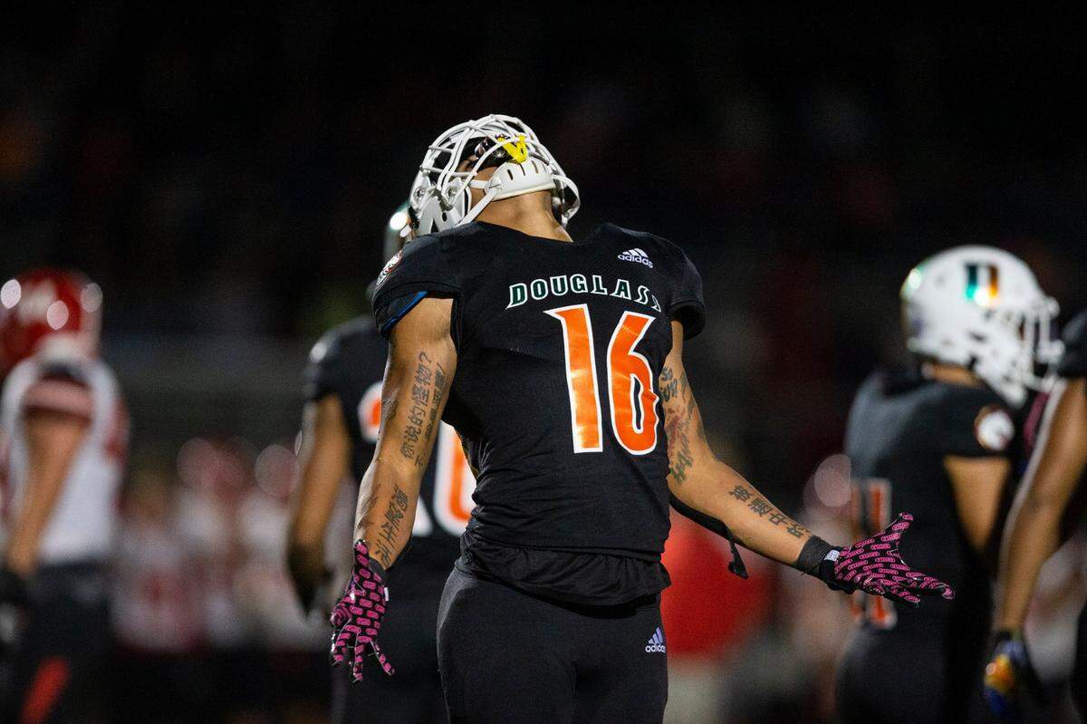 Frederick Douglass’s Davis Joyner (16) celebrated after a play against Scott County. “This is just what we do,” he said of his team’s dominant performance on defense.