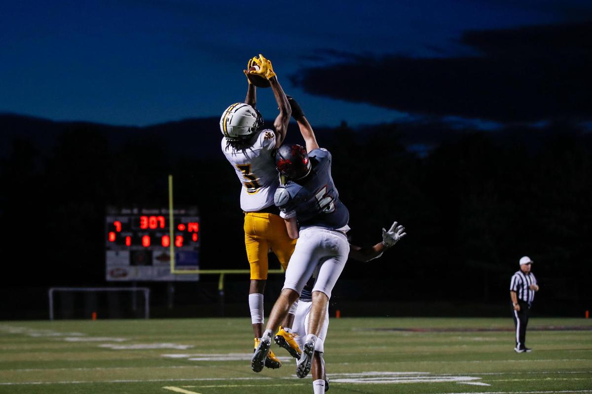 Woodford County’s Makhi Smith (3) went up high to catch a touchdown pass from Andrew Nason during Friday night’s win.