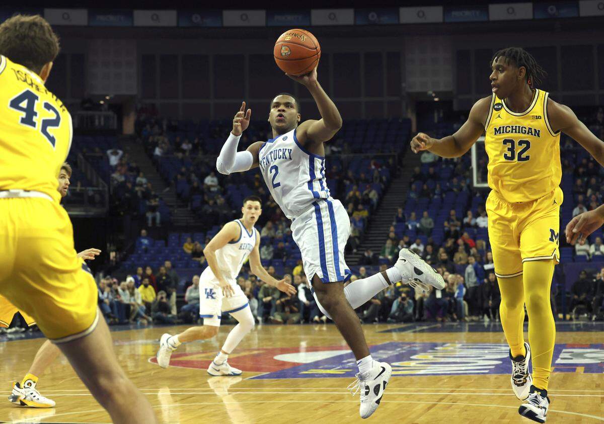 Kentucky Wildcats’ Sahvir Wheeler (2) in action during an NCAA basketball game between Michigan Wolverines and Kentucky Wildcats at the O2 Arena, in London, Sunday, Dec.4, 2022. (AP Photo/Ian Walton)