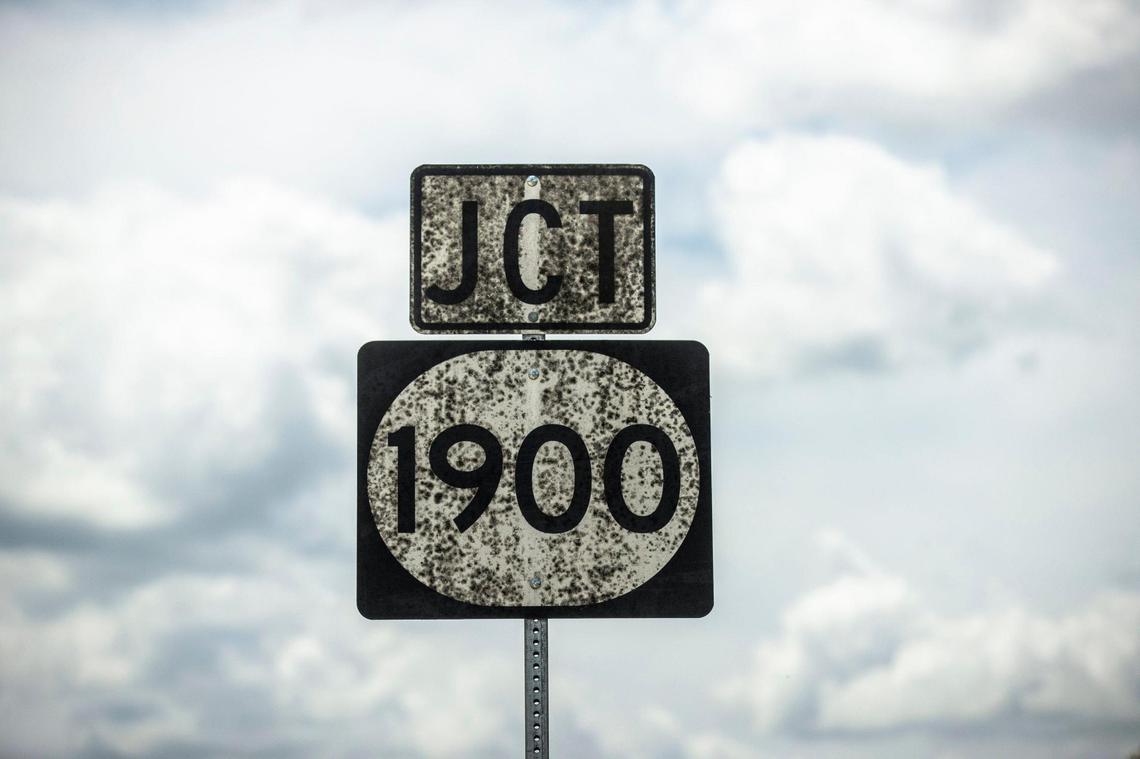 Whiskey fungus grows on a road sign along Owenton Road near the Peaks Mill Road in Franklin County near Buffalo Trace’s bourbon warehouses. Neighbors say the black mold-like growth of Baudoinia compnianencis is hard to scrub off and they are fighting more warehouses on the other side of the road. No one from any Kentucky distillery would comment for these stories.