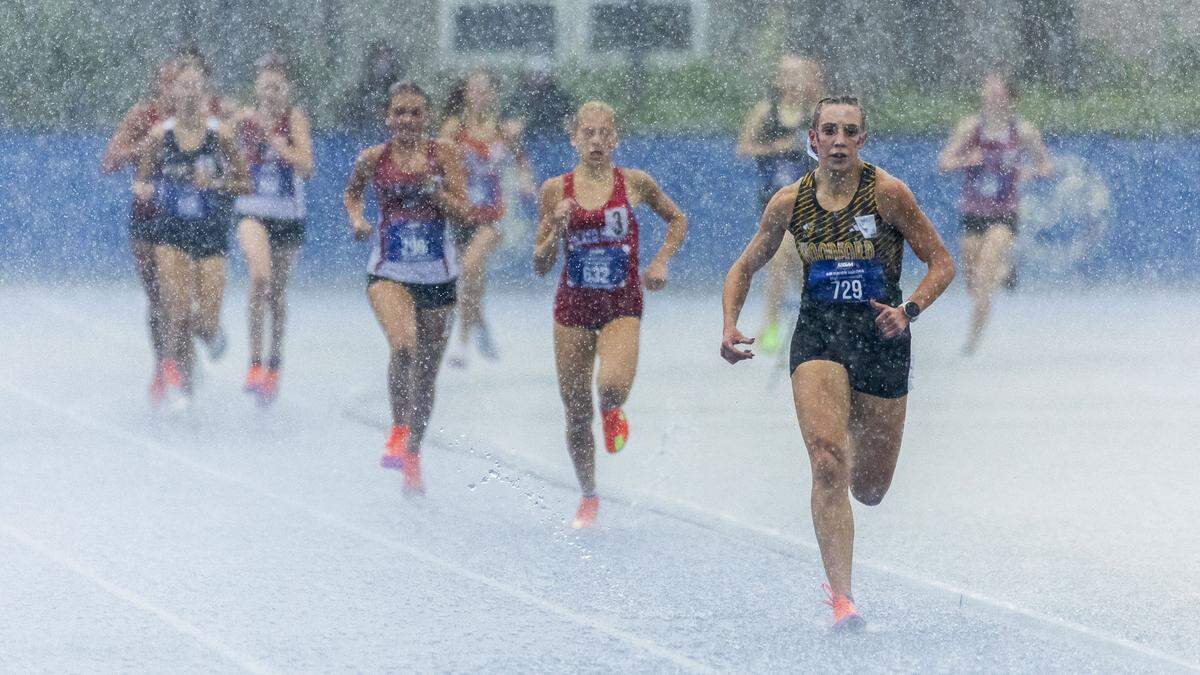 Woodford County's Addison Moore won the girls 1600 meter run in the pouring rain during the 2026 KHSAA Boys and Girls Class 3A State Track and Field Championships at the University of Kentucky track and field complex in Lexington, Ky., on Saturday, May 23, 2026.