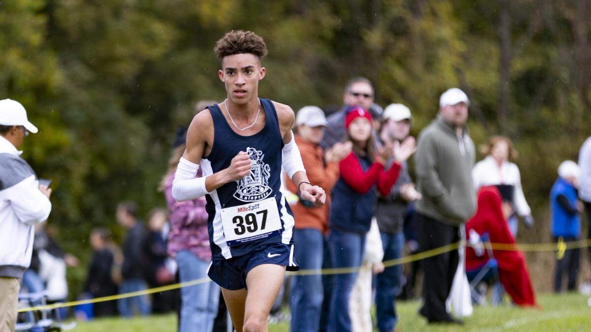 Lafayette’s Xavier Richardson takes his final strides toward the finish line on his way to a first-place finish in the boys Class 3A, 6th Region Cross Country Championships at Shelby County Cross Country Course in Shelbyville on Saturday.